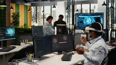 Programmer in office using virtual reality tech to fix hacking attempt Stock-Footage 323238969