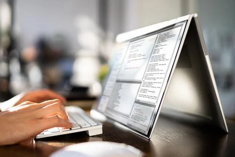 Programmer Or Coder At Office Desk Stock Photos