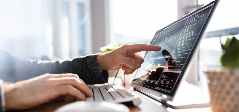 Programmer Or Coder At Office Desk Stock Photos