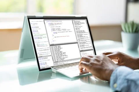 Programmer Or Coder At Office Desk Foto stock