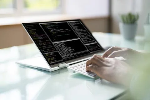 Programmer Or Coder At Office Desk Stock Photos