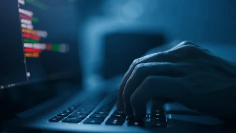 Programmer or computer hacker typing code on laptop keyboard. Closeup Stock Footage 122393558
