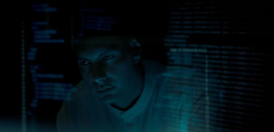 Programmer or Developer working in dark room with computer code reflected o.. 스톡 사진