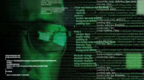 Programmer or hacker in glasses - software code reflecting in the glass and Stock Photos