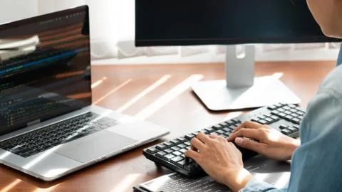 Programmer or software developer Typing New Lines of Code, coding technologie 写真素材