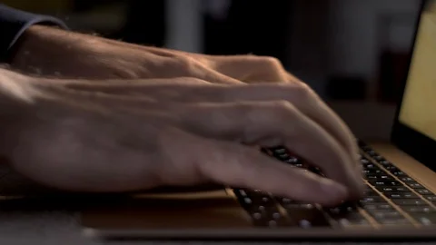 A programmer or writer types on a laptop keyboard Stock Footage 123400815