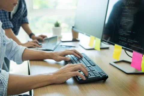 Programmer Outsource Developer Team coding technologies Website design. Mobil Stock Photos