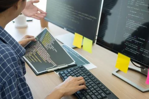 Programmer Outsource Developer Team coding technologies Website design. Mobil Stock Photos