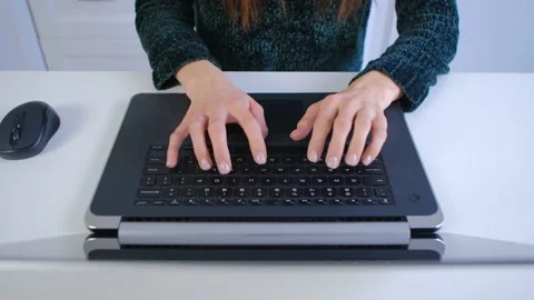 Programmer person coding on a modern notebook pc at home,filmed in 4K from above Stock Footage 239091927