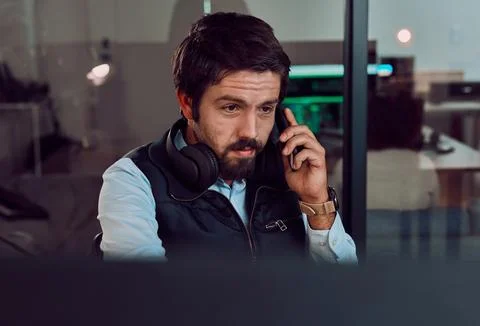 Programmer, phone call and man talking, thinking or chatting and speaking to Stock Photos