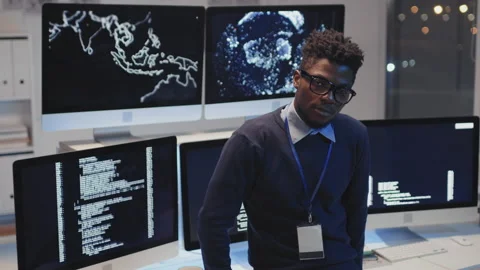 Programmer Posing by Monitors Stock Footage 171062976
