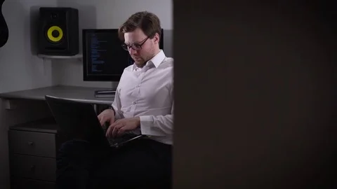 The programmer prepares for setup of the equipment in the computer room. The Stock Footage 72456315