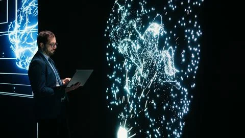 Programmer reconfiguring AI node connections using augmented reality Stock-Fotos