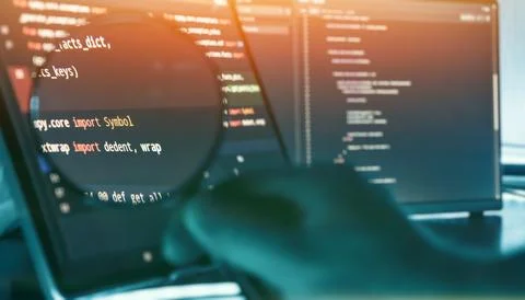 Programmer Reviewing Source Code Through Magnifying Glass on Futuristic 写真素材