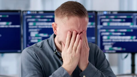 Programmer Rubs Itchy Eye While Working Long Hours Stock-Footage 330582443