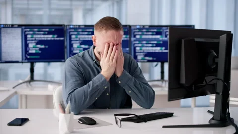 Programmer Rubs Itchy Eye While Working Long Hours Stock Footage 331150456