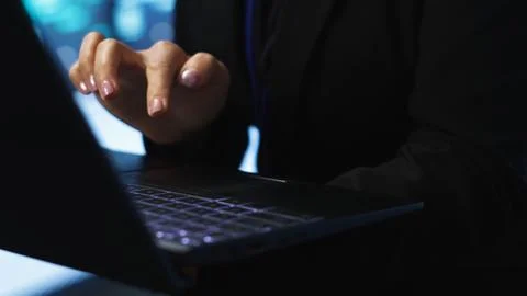 Programmer in server hub checking recovery plan on laptop, close up Stock Photos