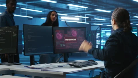 Programmer in server hub requesting assistance during hacking attack Stock Footage 276194175