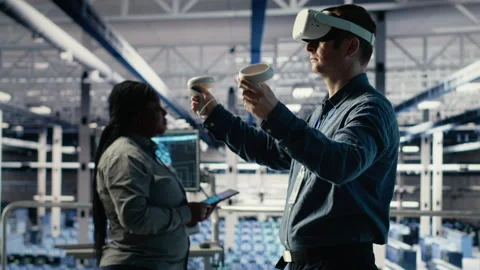 Programmer in server room wearing VR headset optimizing deep learning systems Stock Footage 314685669