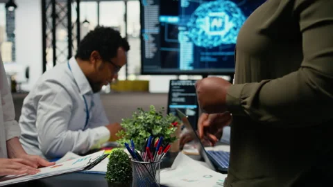 Programmer shaking hand with businessmen in tech agency boardroom Stock Footage 323237847