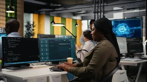 Programmer solving tasks with AI LLM chatbot answering prompts Stock Photos