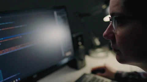 Programmer specialist in programming works remotely at home uses a laptop co Stock Footage 243769660