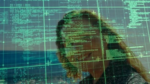 Programmer standing by seaside, engaging with fading grid overlay, analyzing Video stock 319801179