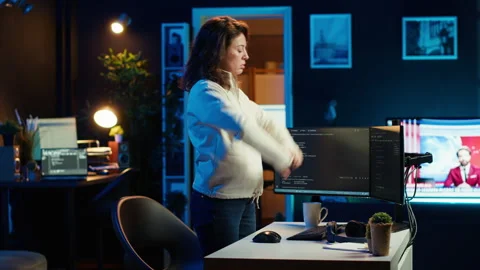 Programmer stretches body limbs after securing company servers from virus Video stock 283692234