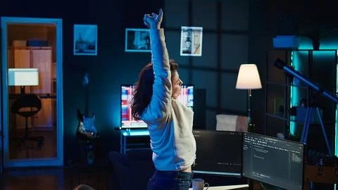 Programmer stretches body limbs after securing company servers from virus Stock Photos