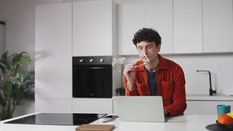 Programmer suffering from eye strain while working on laptop, removing glasses Video stock 337907170
