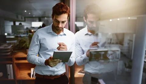 Programmer, tablet and thinking with night, research and overtime work and data Stock Photos