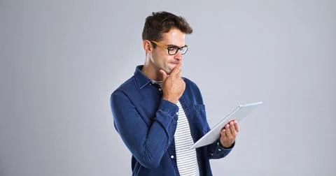 Programmer, tablet or man with thinking in studio for software glitch, planning Stock-Fotos