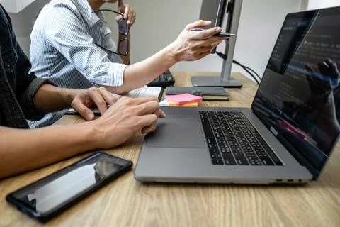 Programmer Team of  Developing programming and website working in a software Stockfoto's