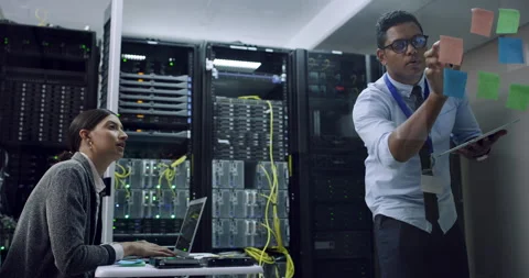 Programmer team, IT server and planning of staff with computer hardware and Stock Footage 242117585