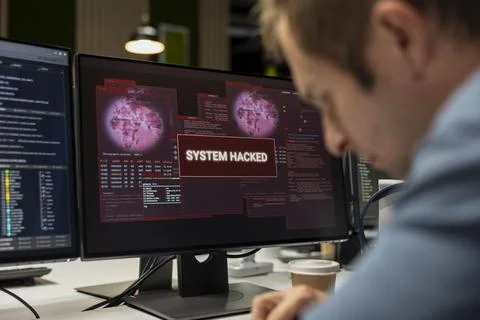 Programmer in tech company office trying to fix hacking attempt on network Stock-Fotos