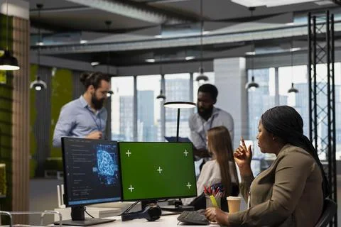 Programmer in tech startup uses AI on chroma key PC to optimize performance Stock Photos