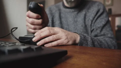 Programmer Tests Computer Game Using Joystick and Keyboard at Desktop Stock Footage 336719317
