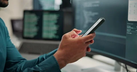 Programmer, texting and hands with phone in office, software development and Stock Footage 346947993