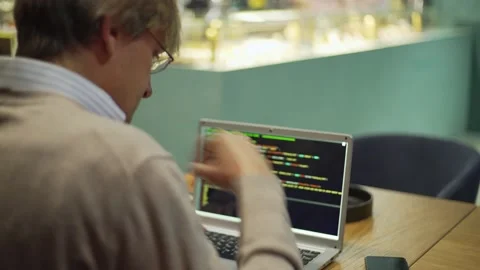 Programmer thinking and coding at cafe table Stock Footage 142381612