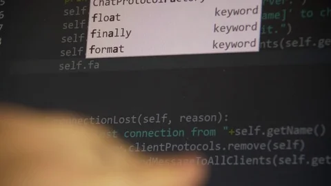The programmer types the code Stock Footage 84648058