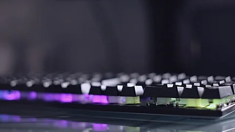 Programmer typing code on backlit keyboard, development and hacking. Men's hands Stock Footage 118574908