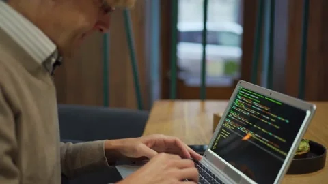Programmer typing code at breakfast in cafe Stock Footage 142381824