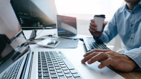 Programmer Typing Code on desktop computer, Developing programming and coding Foto stock