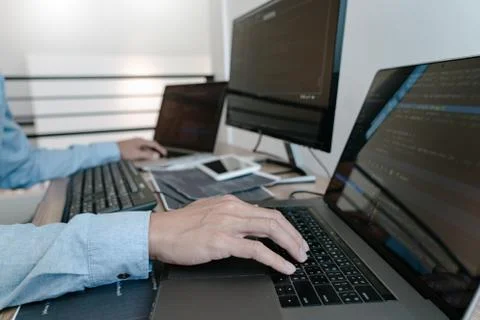 Programmer Typing Code on desktop computer, Developing programming and coding Foto stock
