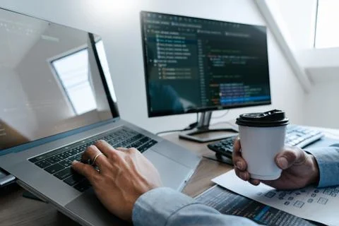 Programmer Typing Code on desktop computer, Developing programming and coding Stockfoto's
