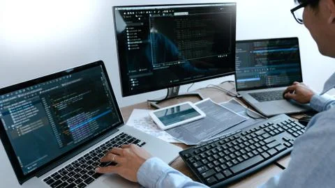 Programmer Typing Code on desktop computer, Developing programming and coding 스톡 사진