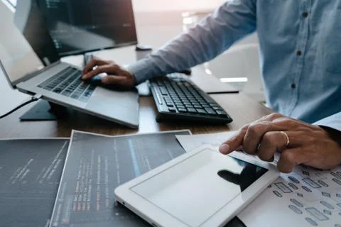 Programmer Typing Code on desktop computer, Developing programming and coding Foto stock