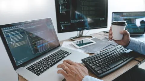 Programmer Typing Code on desktop computer, Developing programming and coding 写真素材