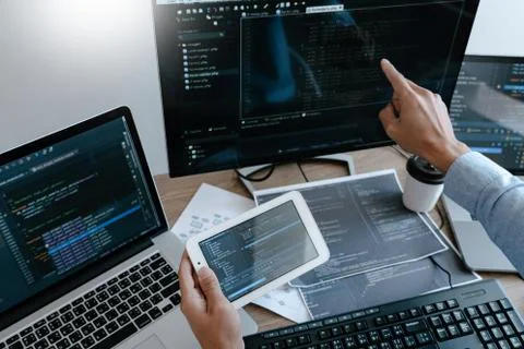Programmer Typing Code on desktop computer, Developing programming and coding Foto stock
