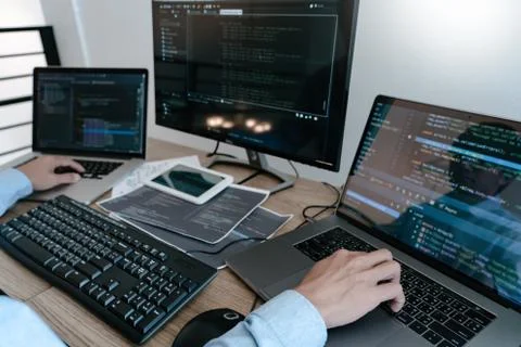 Programmer Typing Code on desktop computer, Developing programming and coding 写真素材
